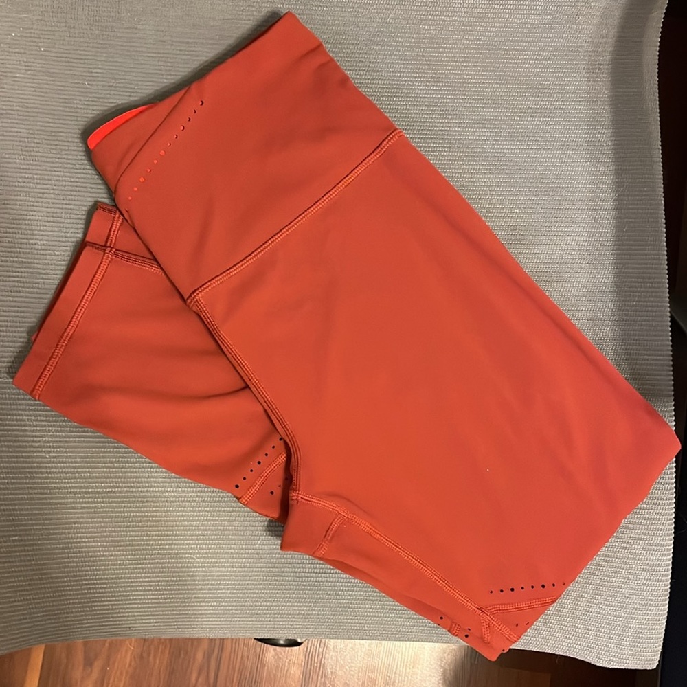 Athleta Salutation 7/8 Tight Rust/Orange Laser Cut Leggings - Medium